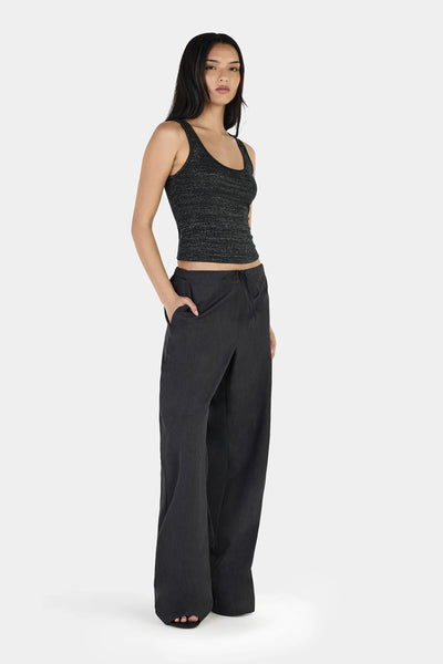 A side-angle profile studio view of the slate grey trousers, highlighting the integrated functional side seam pockets and the relaxed, tailored drape along the leg.