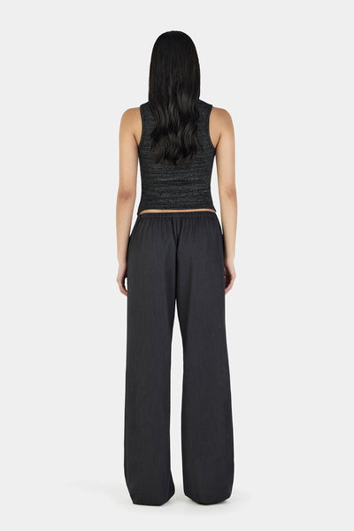A full back view of the Caleb Pant on a model, showcasing the clean, smooth fit over the hips and the comfortable gathering of the elasticated back waistband.