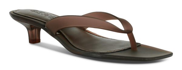 A direct front studio profile shot of the Senso Sonya heeled mule in Chestnut, highlighting the clean, structural thong strap placement, prominent square toe architecture, and the distinctive high-gloss light reflection across the deep brown upper.
