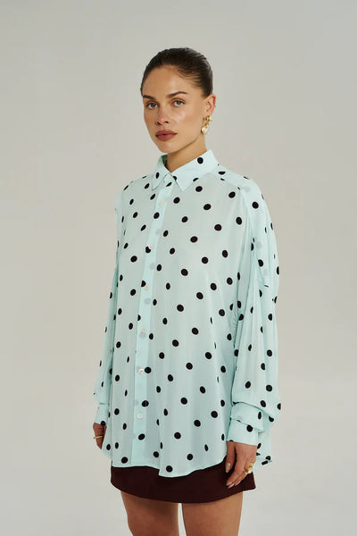 The Dotty long-sleeve shirt in Pinot Drops print, featuring a classic button-down front and relaxed structure in 100% woven viscose.