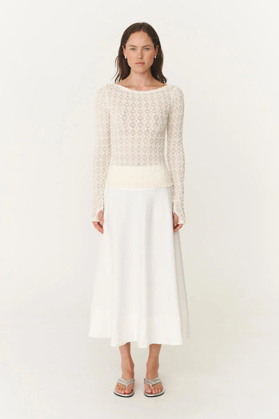 Model wearing the Samantha lace top, illustrating the body-skimming fitted silhouette and the lightweight, breathable stretch of the nylon-spandex blend.