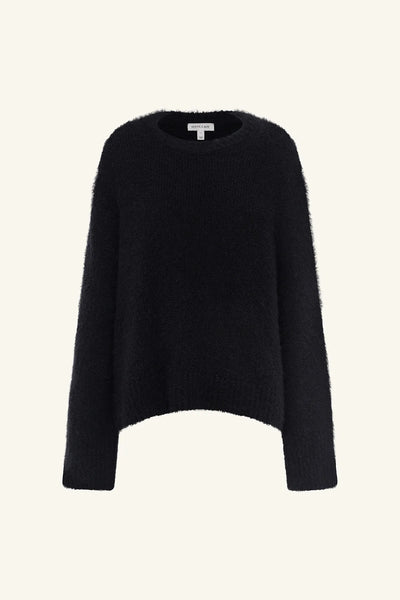Front studio view of the Shona Joy Korine Boucle Knit in black featuring a round neckline, ribbed edges, dropped shoulders, and a fluffy wool-blend textured weave.