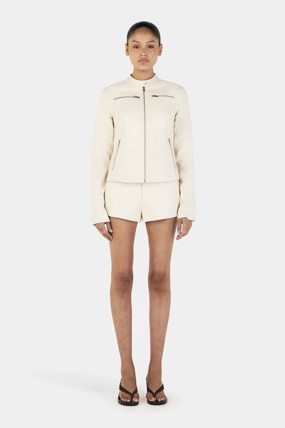 Model wearing the cream Tari Moto Jacket, showcasing the tailored waist and the sophisticated, motorcycle-esque aesthetic on a 177cm frame.