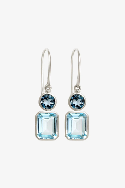Studio product shot of a pair of Temple of the Sun Aqua Earrings in Sterling Silver featuring a round London Blue Topaz above an emerald-cut Sky Blue Topaz on silver drop hooks.