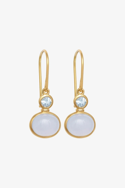 Studio product shot of a pair of Temple of the Sun Ether Earrings in 18k Gold Vermeil featuring round Sky Blue Topaz and oval Blue Chalcedony cabochon drops against a plain background.