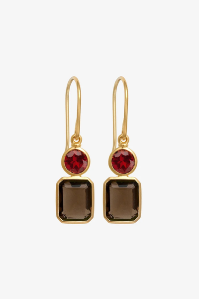Studio product shot of the pair of Temple of the Sun Umber Earrings in 18k Gold Vermeil featuring round garnet and oval smoky quartz drop gemstones on gold hooks.