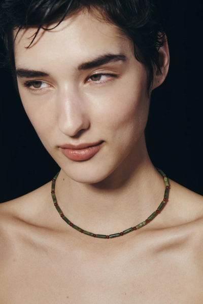 Front portrait photo of a model wearing the Temple of the Sun Vana Beaded Necklace as a choker.