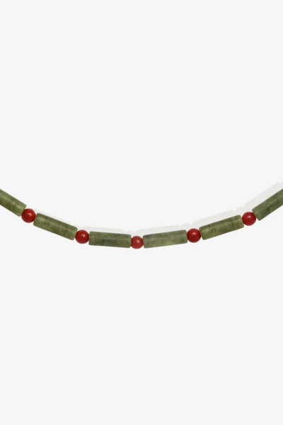 Close-up cropped product image showing the detailed green serpentine jade tube beads and red agate accents of the Vana Beaded Necklace.