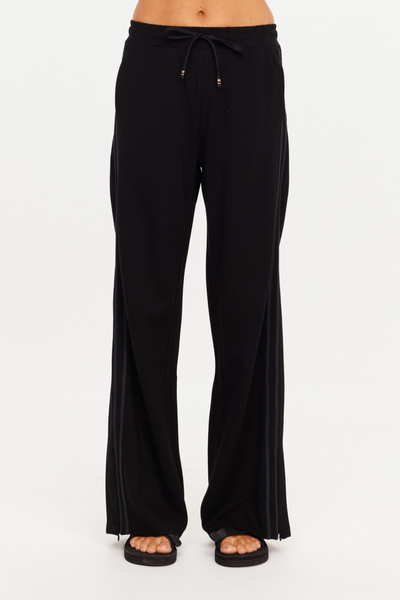 Front shot from the waist down featuring the elastic waistband with drawcord and contrast dipped ends on The Upside Roma Pant in black.