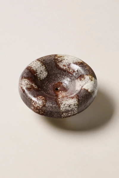Overhead studio view of the Gentle Habits Vessel Incense Holder in Chocolate showing its rounded ceramic dish shape with a chocolate brown and cream striped glaze.