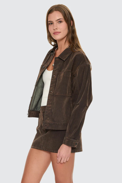 A three-quarter side angle profile view showing the jacket styled open, emphasizing its versatile layering potential over a casual top.
