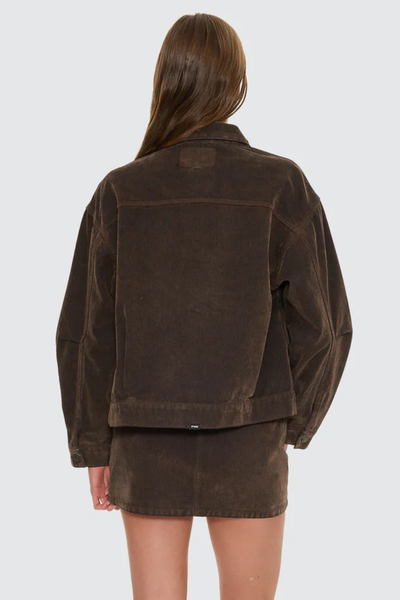 A rear-angle studio shot focusing on the upper back yoke and the classic down-turned collar structure.