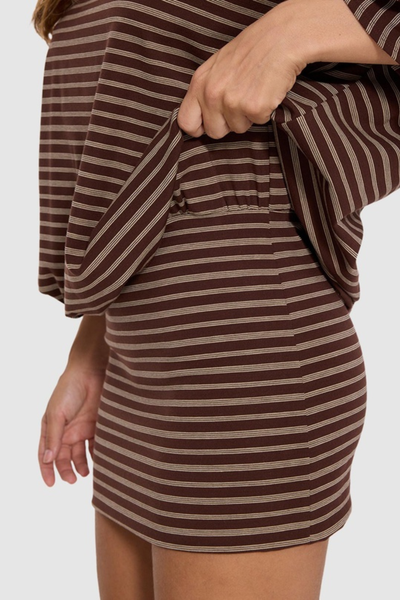 Close-up side view of the Thrills Best Of Luck Demi Mini Dress in Cocoa showing the fabric texture, waist gather construction, and fitted striped mini skirt.