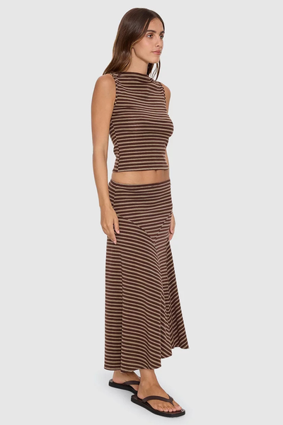 Three-quarter side view of model posing in the brown striped Thrills Best of Luck Sienna Midi Skirt made from Tencel elastane stretch knit fabric.