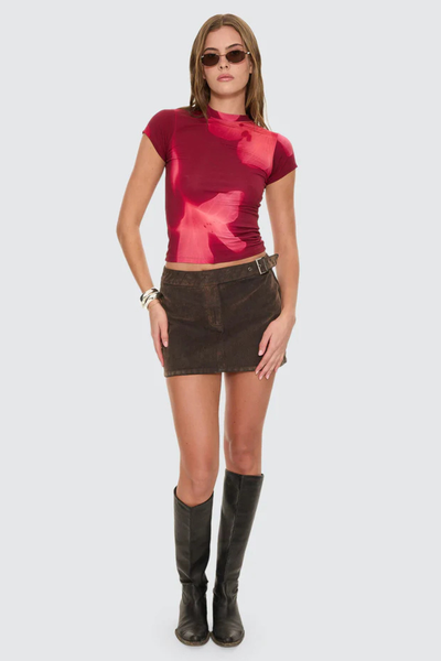 A full-length front studio shot of a model wearing the Thrills Nightbloom Club Tee in Garnet Orchid, showcasing the slim, body-skimming silhouette, classic crew neckline, and abstract all-over floral print.