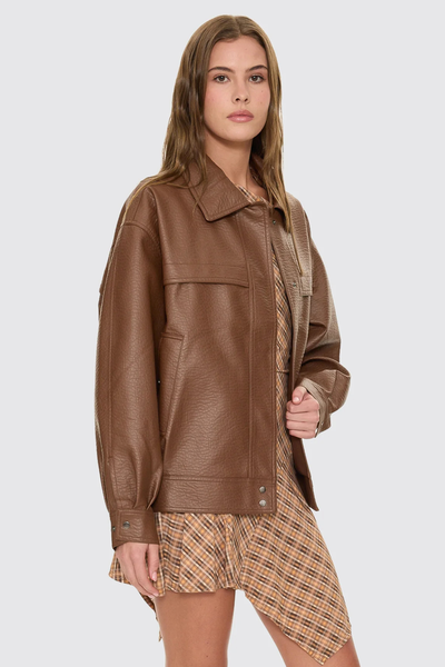 A closer front e-commerce image displaying the faux leather jacket fully zipped, showcasing the clean central zipper track and the slightly cropped, boxy hemline.