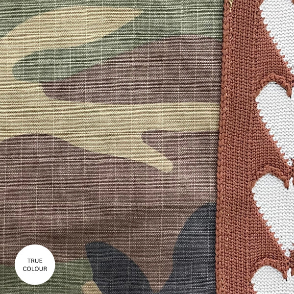 A high-definition swatch tile capturing the true-colour depth of the abstract camouflage print motif and the durable, tightly woven diagonal grain of the 100% cotton canvas drill textile.