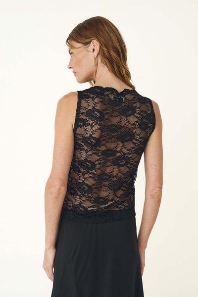Studio rear view of a model wearing the sheer black rose lace tank, highlighting the sleeveless cut and scalloped boat neckline.