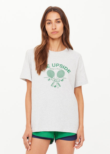 The Upside Racquet Casey Tee in grey marle. Featuring a vintage-inspired "Making a Racquet" logo in British Racing Green, this regular-fit organic cotton jersey tee offers sustainable, modern comfort.
