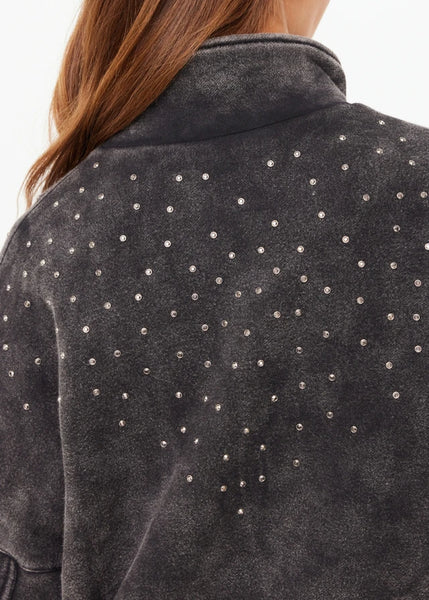 A "tough-meets-luxe" moto jacket in a heavy-weight charcoal black fleece, blending rugged street-style with sophisticated sparkle accents.
