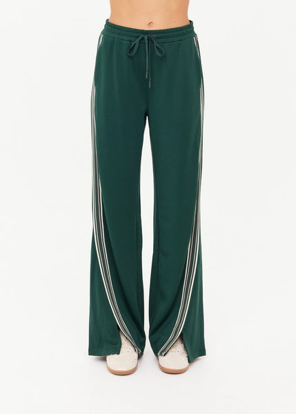 Rear view of the dark green Roma track pants highlighting the back pockets and a small logo pip detail for an authentic retro-athletic look.