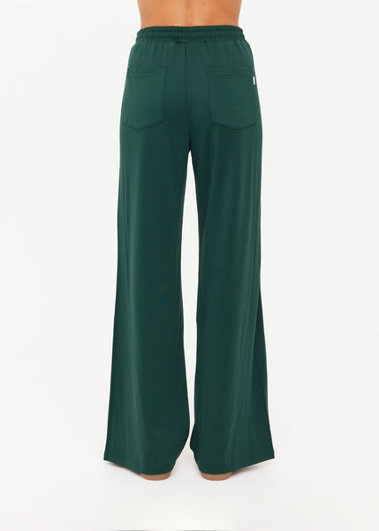 High-waisted, retro-inspired athletic track pants in deep forest green, designed with a polished, wide-leg sport-luxe finish.