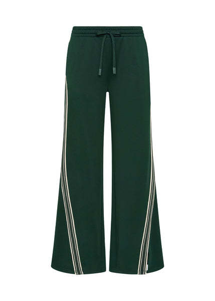 A close-up of the Roma Pant’s double-faced single jersey fabric in dark green, showing the premium texture and coated metal aglets on the drawcord.