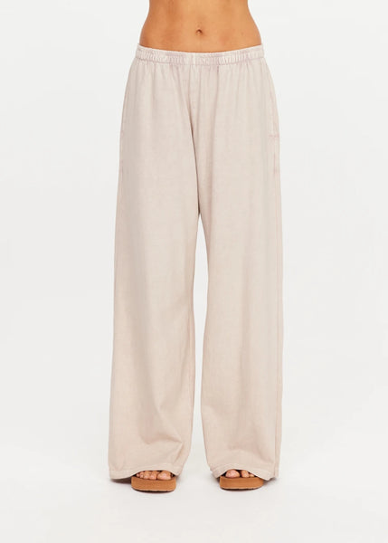 Side profile view of a model showcasing the clean drape and full-length cut of the Soho Tokio Wide Leg Pant.