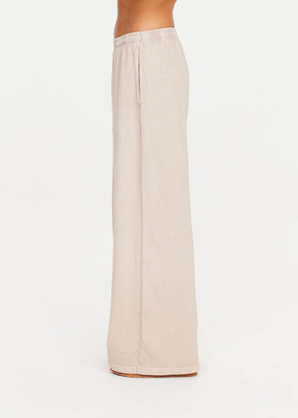 Side profile view of a model showcasing the clean drape and full-length cut of the Soho Tokio Wide Leg Pant.