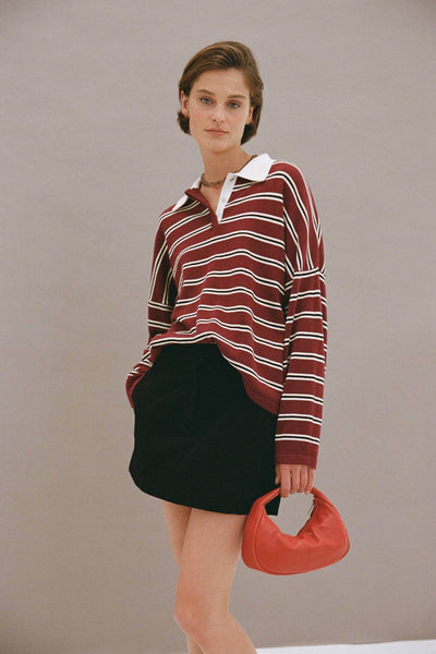 Model wearing the Rayne knit, illustrating the intentional "off-body" shape created by the dropped shoulders and wide-cut body.