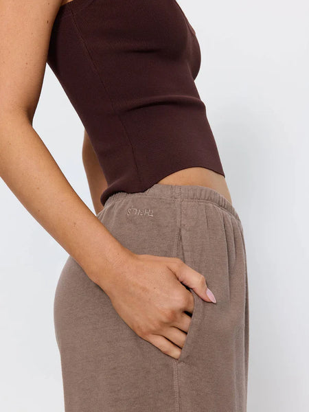 Close-up side profile shot of the Thrills Hemp Relax Pant in Falcon brown, showcasing the elasticated waistband, side pocket detail, and embroidered tonal Thrills logo.