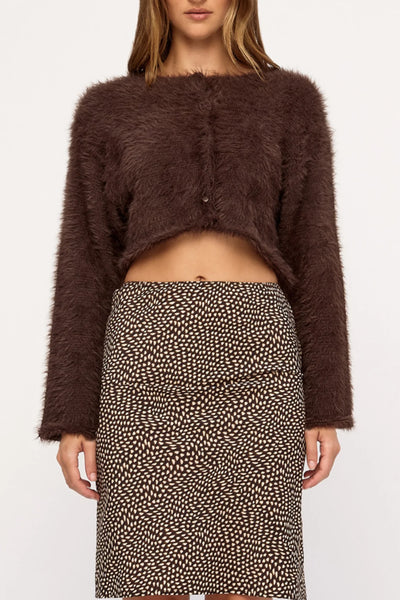 Cropped studio detail shot showing the scooped neckline, button closure, and high-pile texture of the Zulu & Zephyr Fully Knit Cardigan in Chocolate.