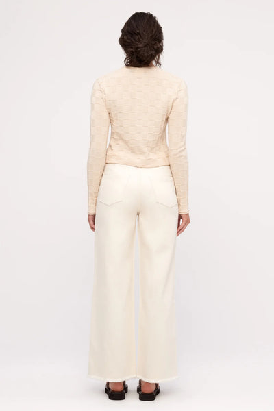 The back of the jeans highlighting the vegan jacron patch on the waistband and the clean, high-quality construction of the rear pockets.