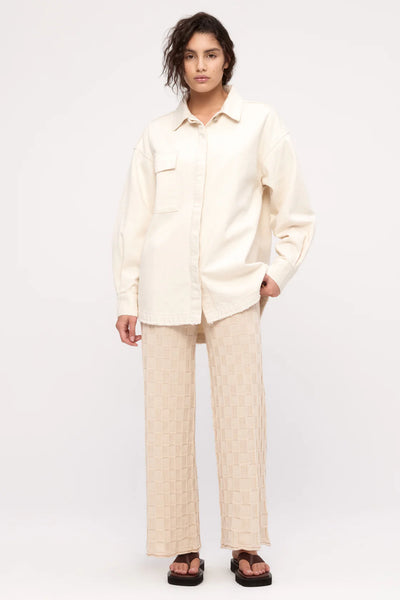 Model wearing the oversized Zulu & Zephyr shirt jacket, illustrating the dropped shoulders and large front chest pocket.