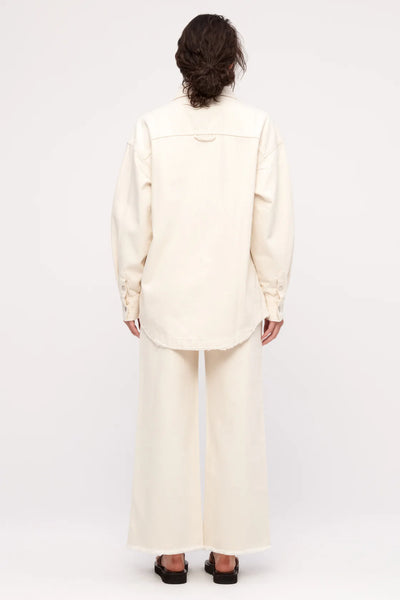 A shot of the long sleeves and traditional shirt cuffs, highlighting the versatility of the piece as a standalone shirt or a lightweight outer layer.