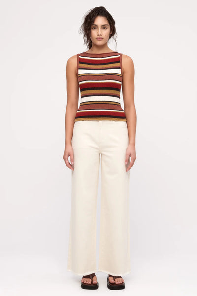 A minimalist pair of wide-leg organic cotton jeans in an earthy Coconut hue, perfect for pairing with tonal knitwear or the matching shirt jacket.