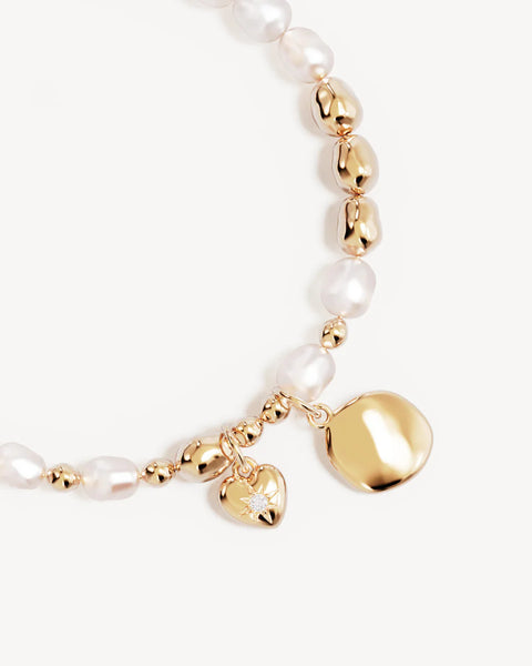 Pearl and gold beaded bracelet with heart-shaped charms 