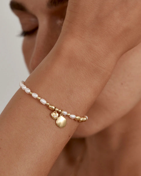 18k gold vermeil bracelet with freshwater pearls and cubic zirconia.