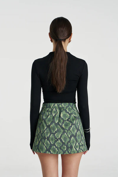 Back profile highlighting the discreetly built-in shorts for active coverage while maintaining the appearance of a classic mini skirt.