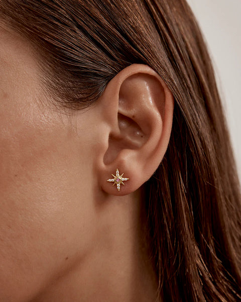 18k gold vermeil star earrings featuring lab-grown pink sapphires and cubic zirconia. Celestial studs for love and connection