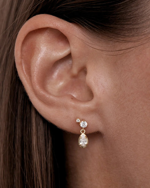 On-model ear profile shot demonstrating the By Charlotte Quiet Radiance Drop Stud Earring in 18k gold vermeil styled in a lobe piercing.