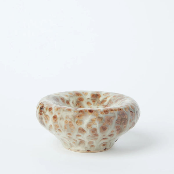 Studio side view of the Gentle Habits Vessel Incense Holder in Seafoam showcasing its rounded ceramic basin and textured seafoam blue and brown reactive glaze.