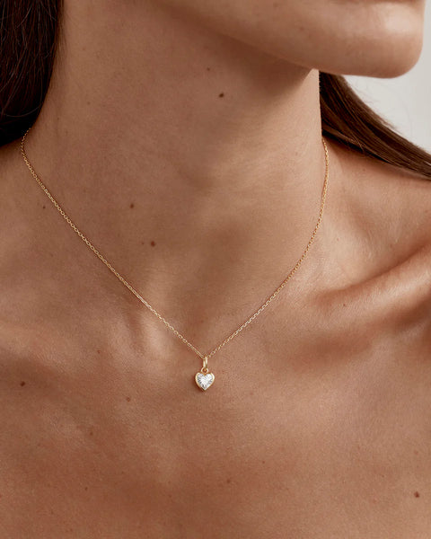 18k gold vermeil necklace featuring a heart-cut cubic zirconia in a bezel setting. Includes an adjustable slider and signature diamond cut cable chain.
