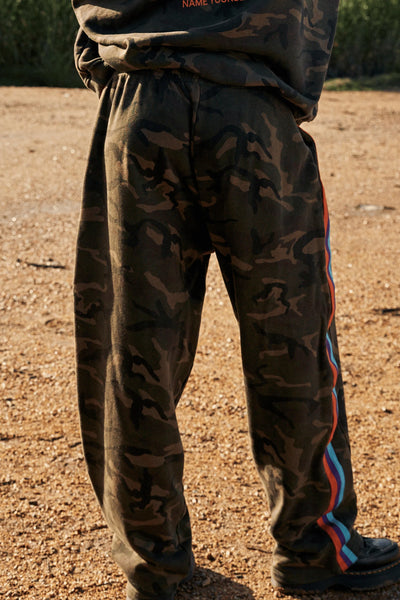 A full back view demonstrating the easy, off-duty fit and the consistent camo pattern across the 100% cotton material.