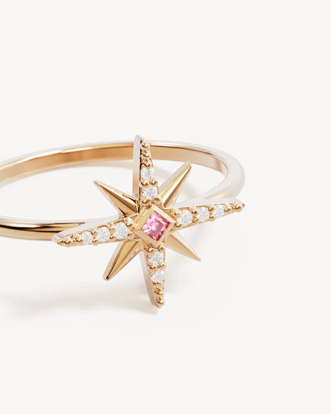 Gold star-shaped ring with a pink gemstone