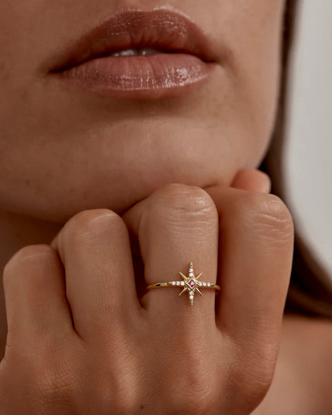 18k gold vermeil star ring featuring a lab-grown pink sapphire and cubic zirconia. A polished, celestial keepsake symbolizing love and unbreakable bonds.