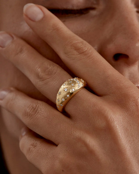 18k gold vermeil statement ring featuring sparkling cubic zirconia moon and star motifs. A polished celestial design inspired by deep affection and devotion.