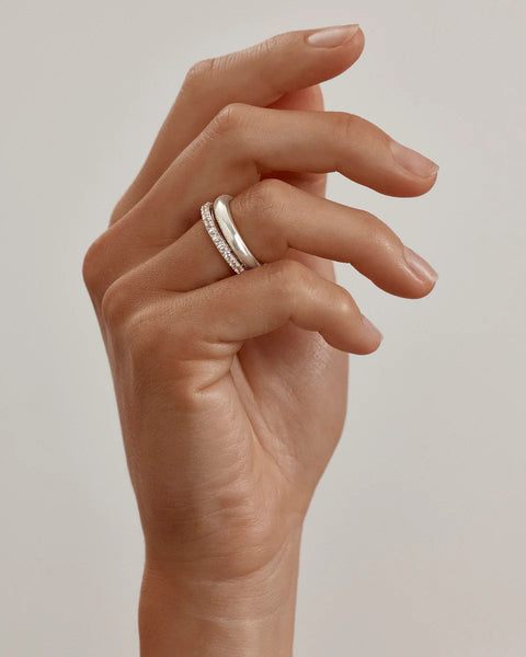 Sterling silver double band illusion ring featuring sparkling cubic zirconias.