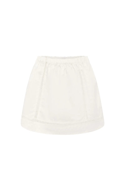 Ghost mannequin front product shot of the white cotton Suri lace mini skirt featuring an elasticated waistband and delicate lace trim details.