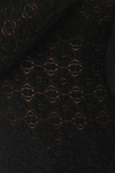 Close-up of the semi-sheer black stretch lace, highlighting the delicate clover pattern and the high-quality nylon-spandex blend.